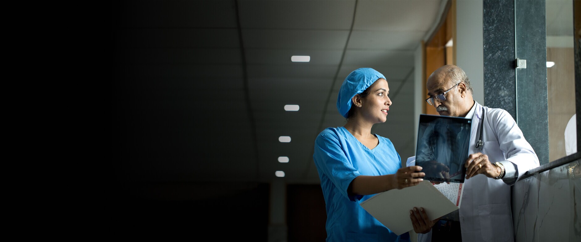 Nurse talking to doctor