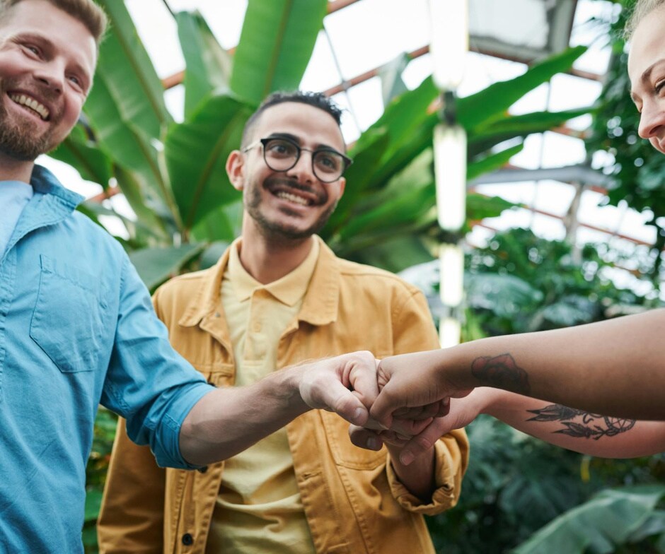 People giving each other fist bumps