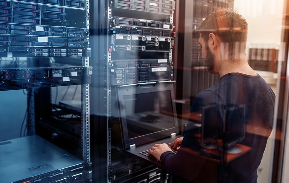 person working on a server terminal monitor