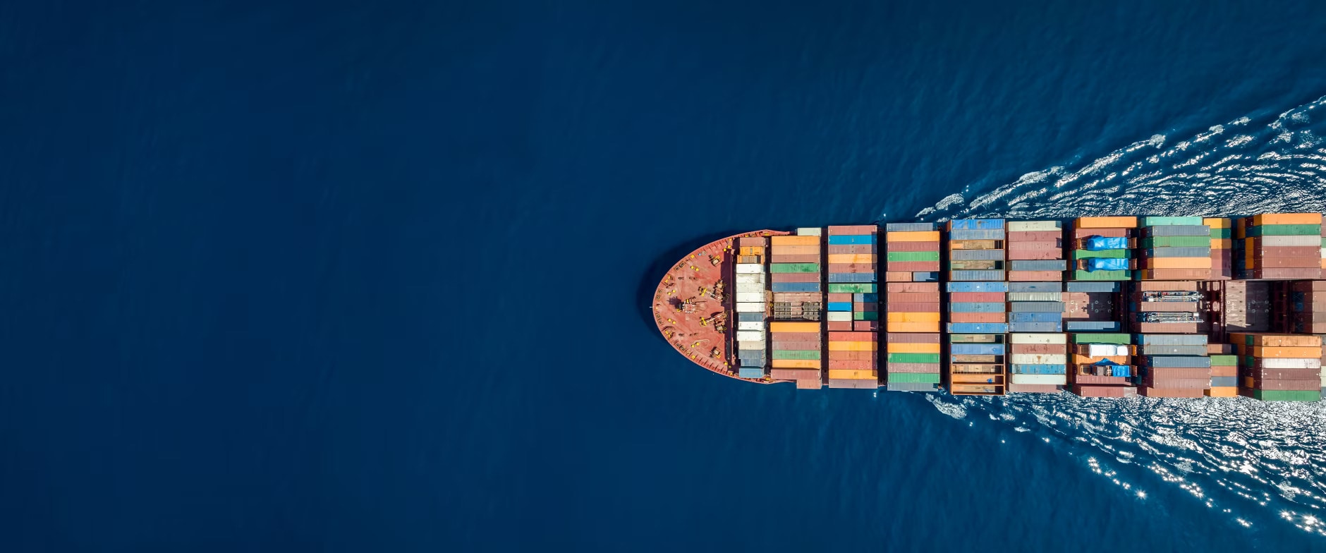 cargo ship sailing in ocean with clear water