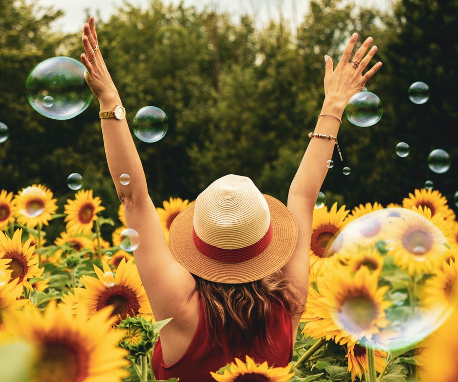 women surrounded by flowers