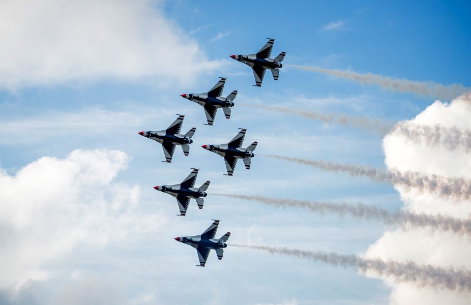 six jet flights flying together in sky