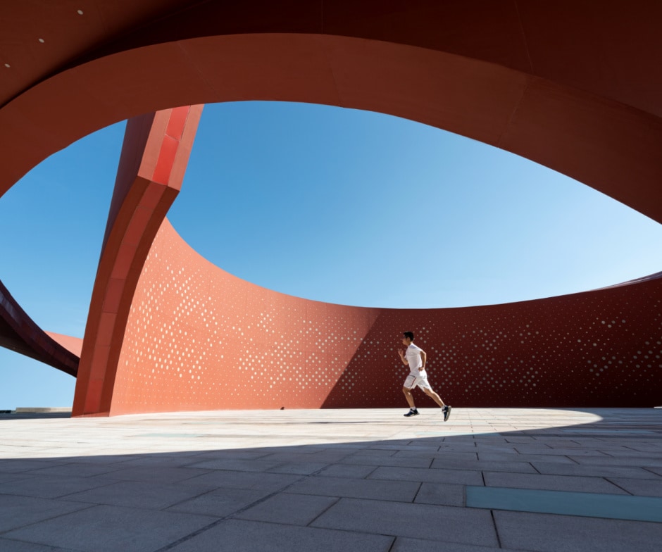 Man running inside the spiral shape building