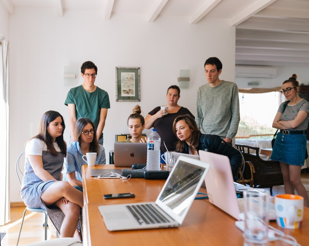 Working people around the computer