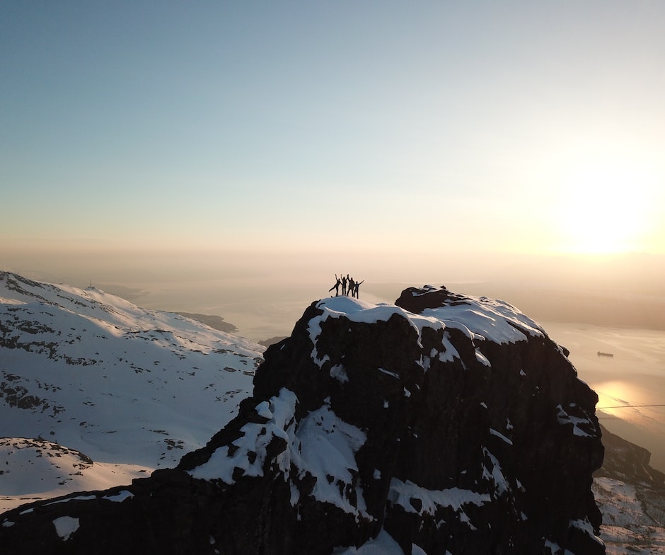 hikers on top of ice mountain